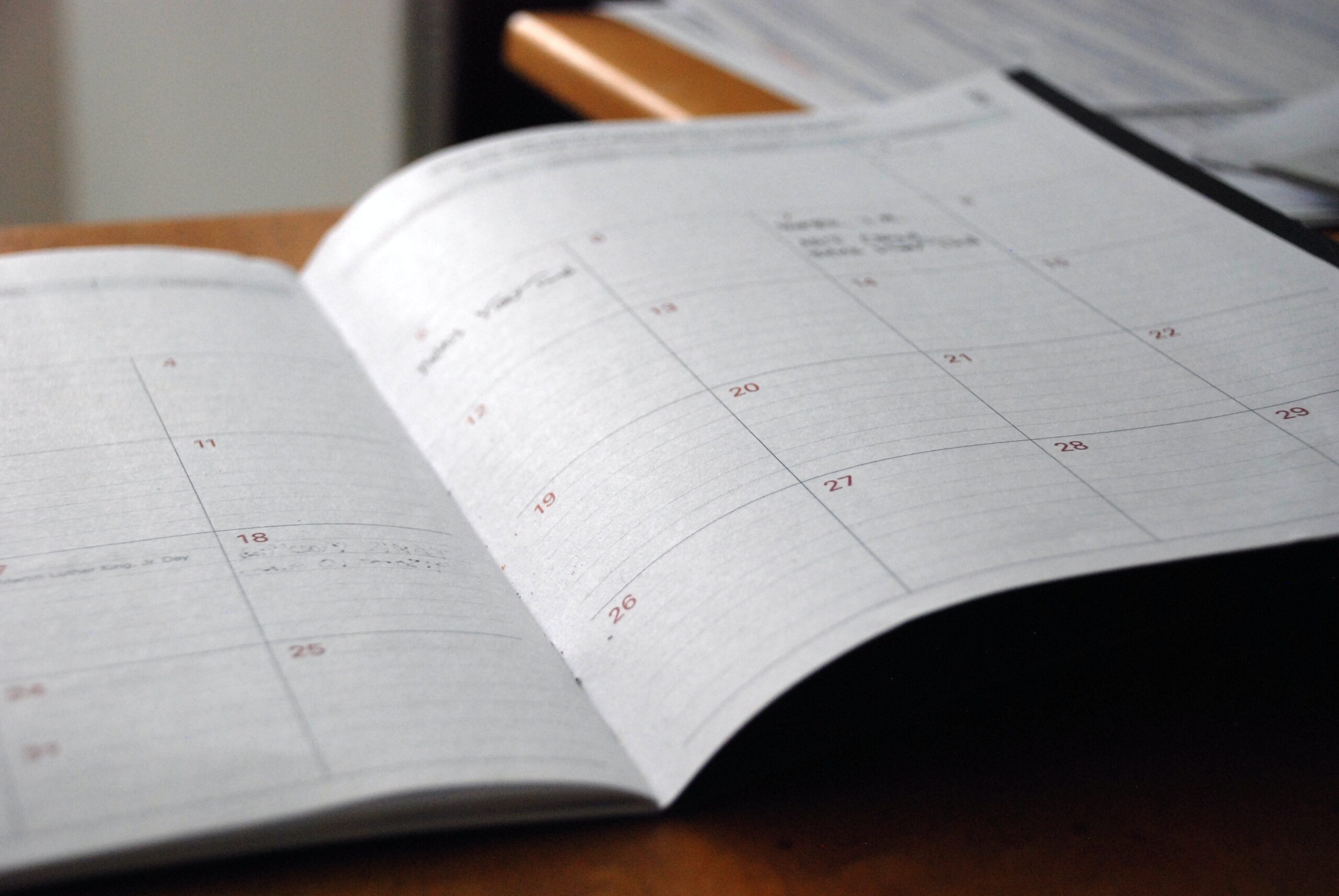 Image showing an opened book style paper calendar to support blog content on calendar automation